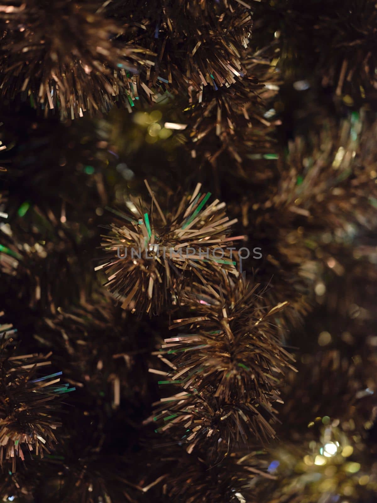 Christmas and Happy new year on blurred bokeh christmas tree . Golden tone . SPACE FOR TEXT 