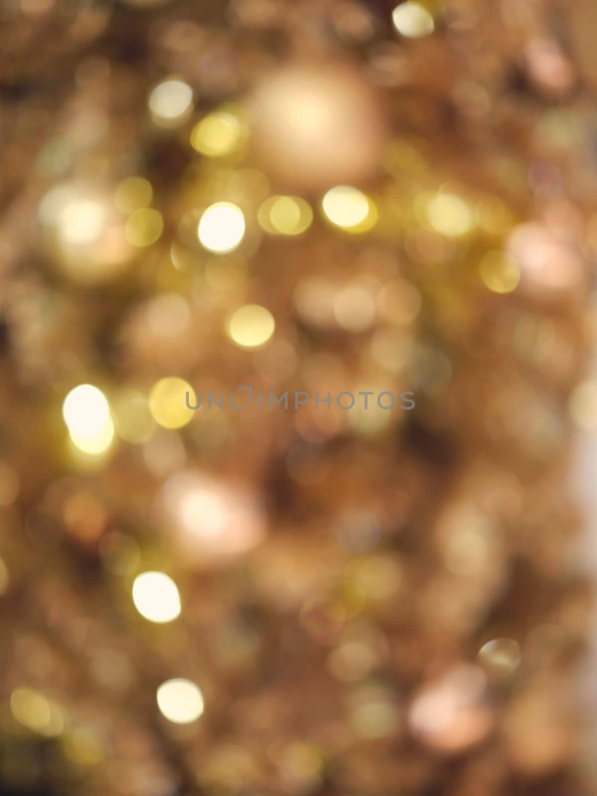 Christmas and Happy new year on blurred bokeh christmas tree . Golden tone . SPACE FOR TEXT 