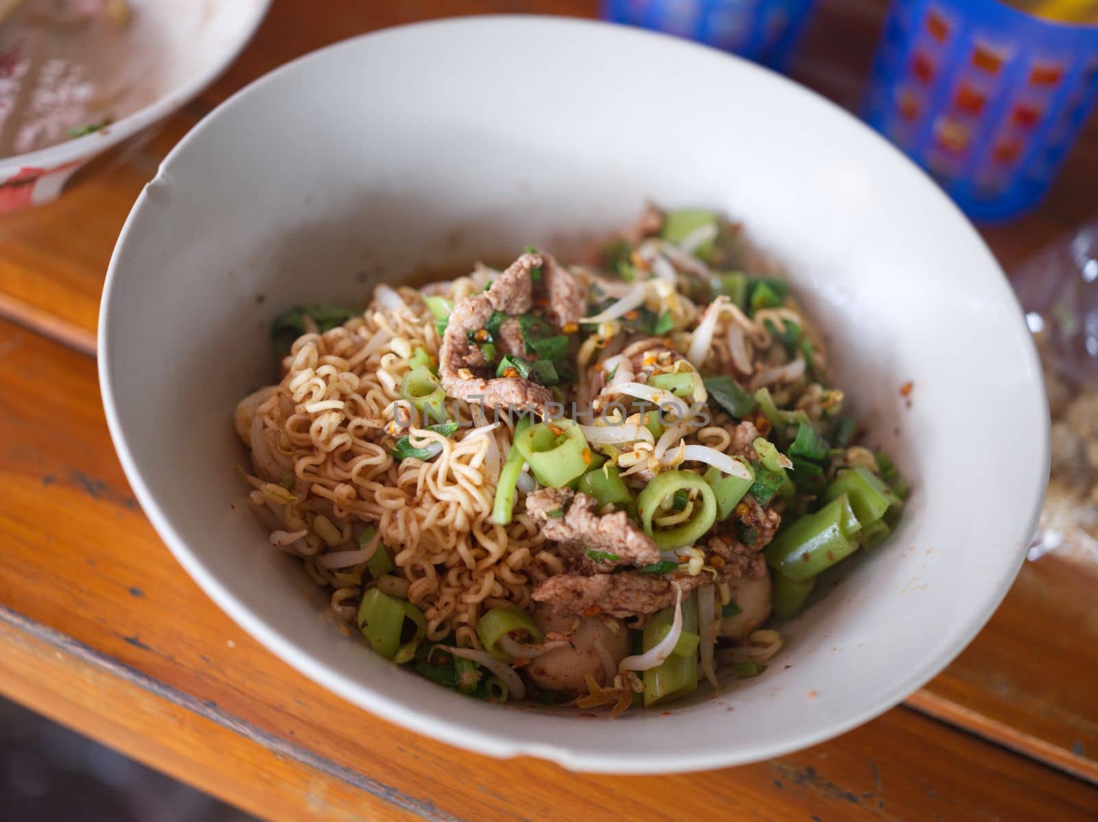 Thai Noodle beef is very delicious on wood table