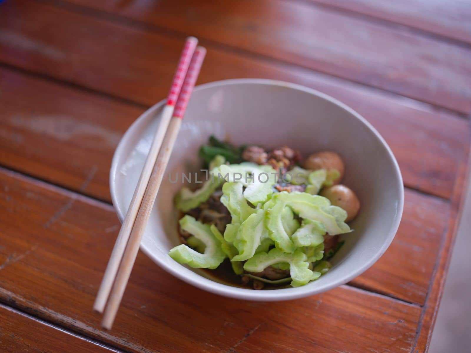 Thai Noodle beef is very delicious on wood table