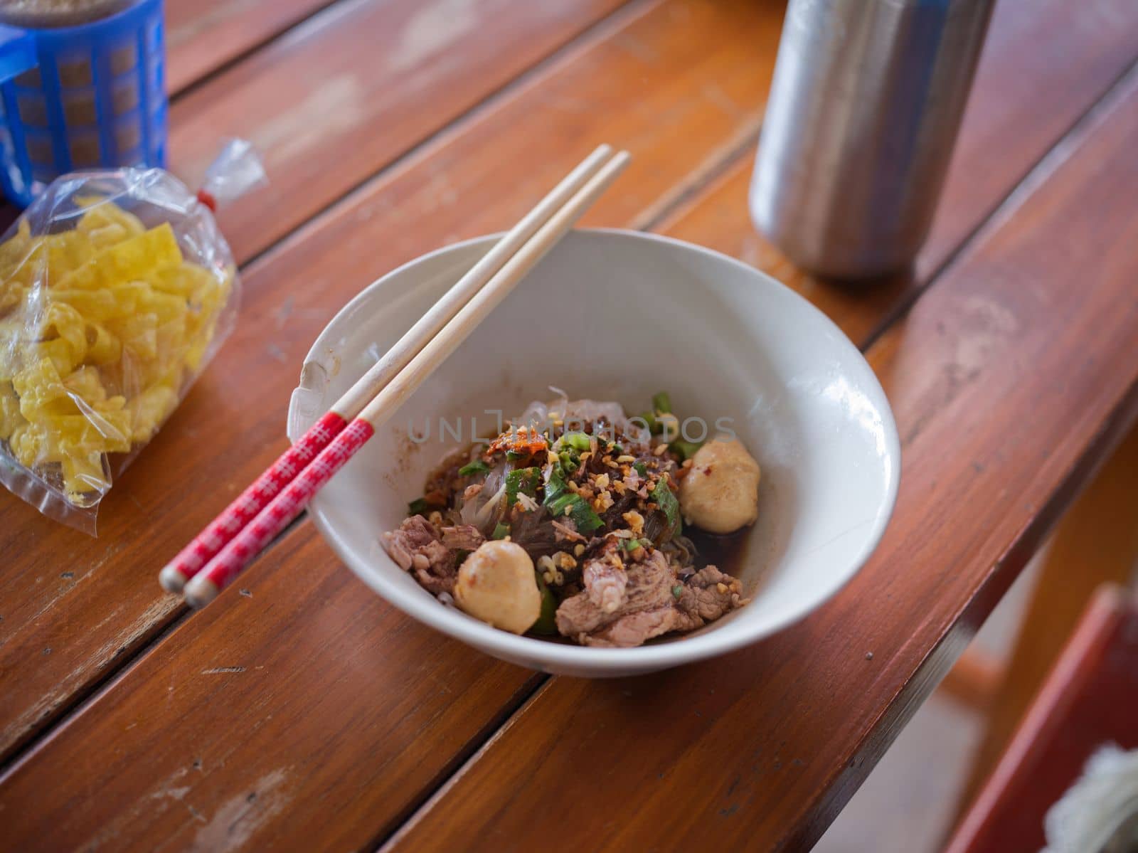 Thai Noodle beef is very delicious on wood table by Hepjam