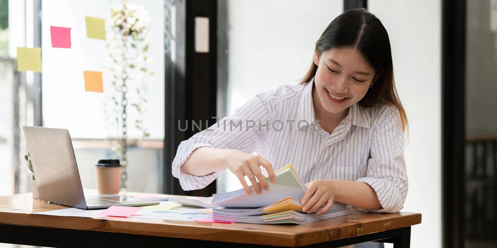 Stack of financial report paper documents for business desk, Business papers for Annual Reports files.