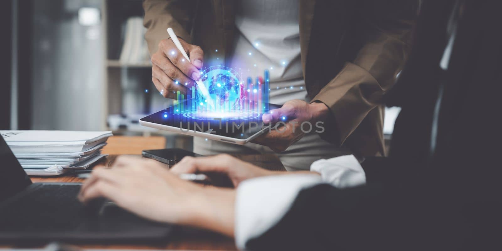 Business growth, planning and strategy concept. Group of Business people using digital tablet with growing virtual hologram of statistics by itchaznong