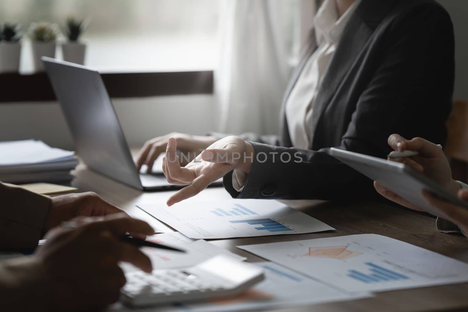 Group of business asian people analysis financial graph on desk at meeting room by itchaznong