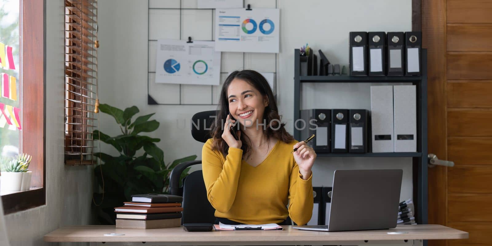 Smart asian business woman smiling at office space. real estate, lawyer, non-profit, marketing.