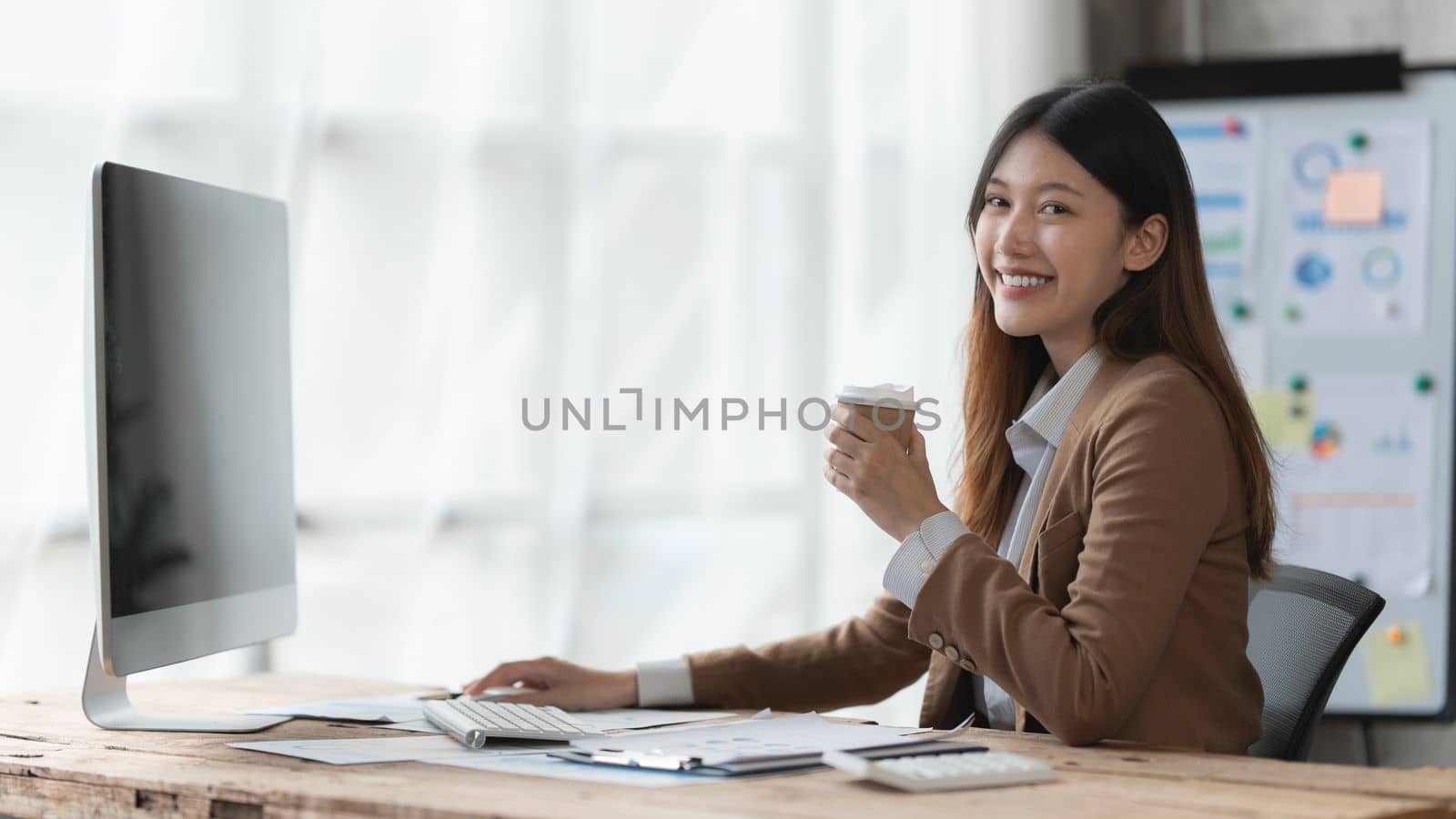 Asian Business woman working with computer at home. work from home concept by itchaznong