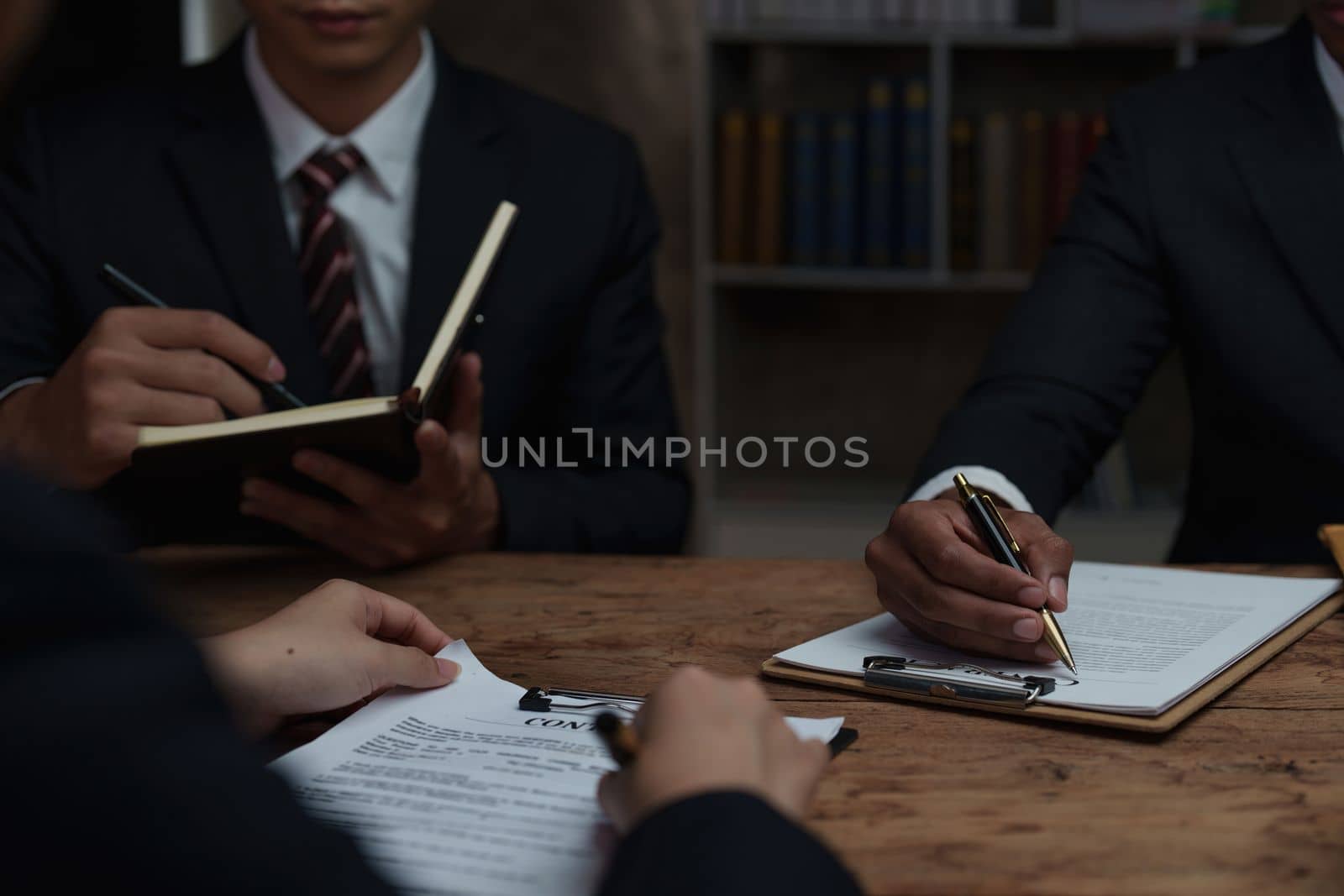 Group of Lawyer working and discussing in office workplace for consultant lawyer concept. Law, legal services, advice, Justice concept by itchaznong