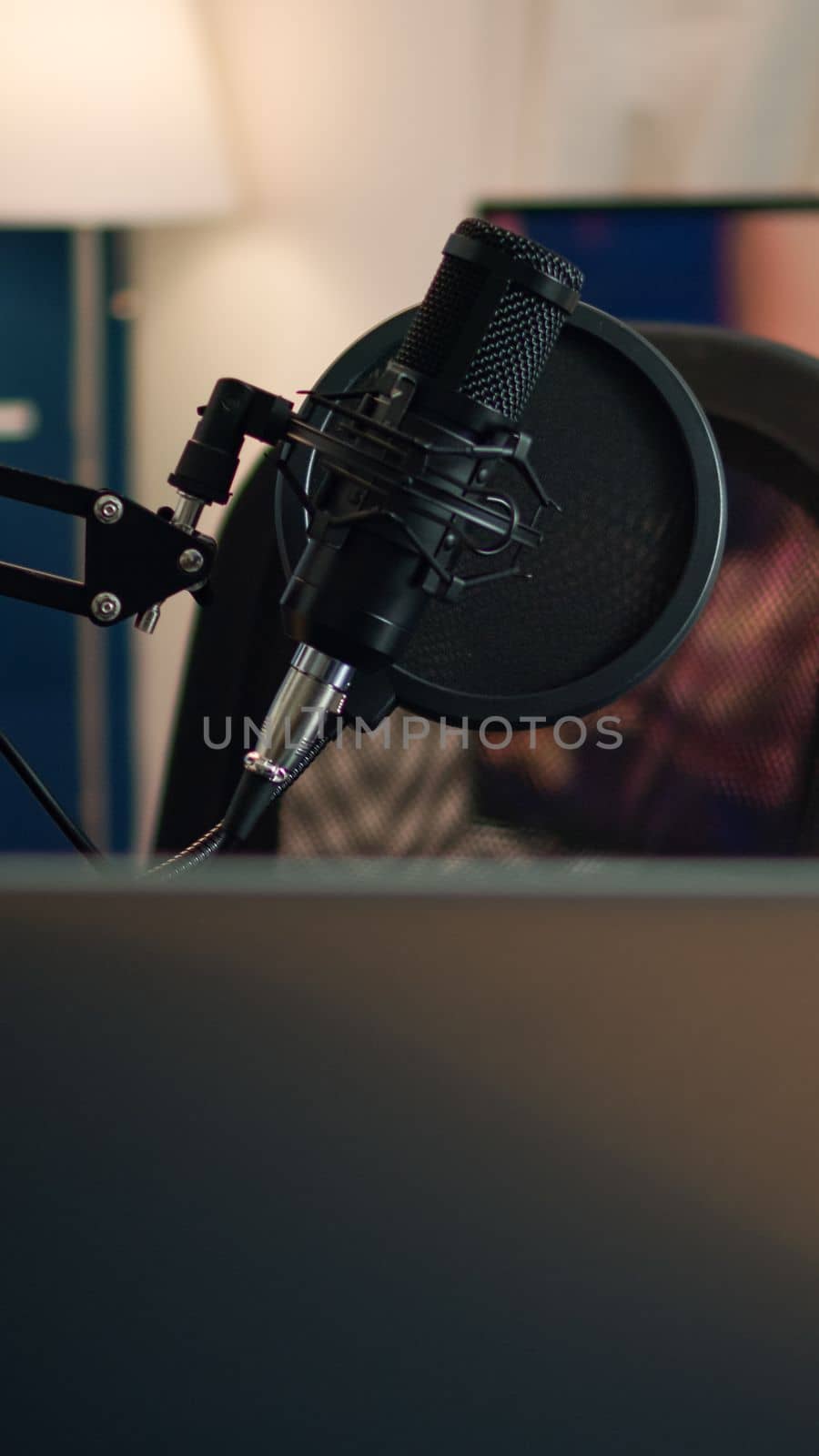 Podcast home studio in living room with professional brodcasting gear with nobody in it. Influencer recording social media content with production microphone, digital web internet streaming station