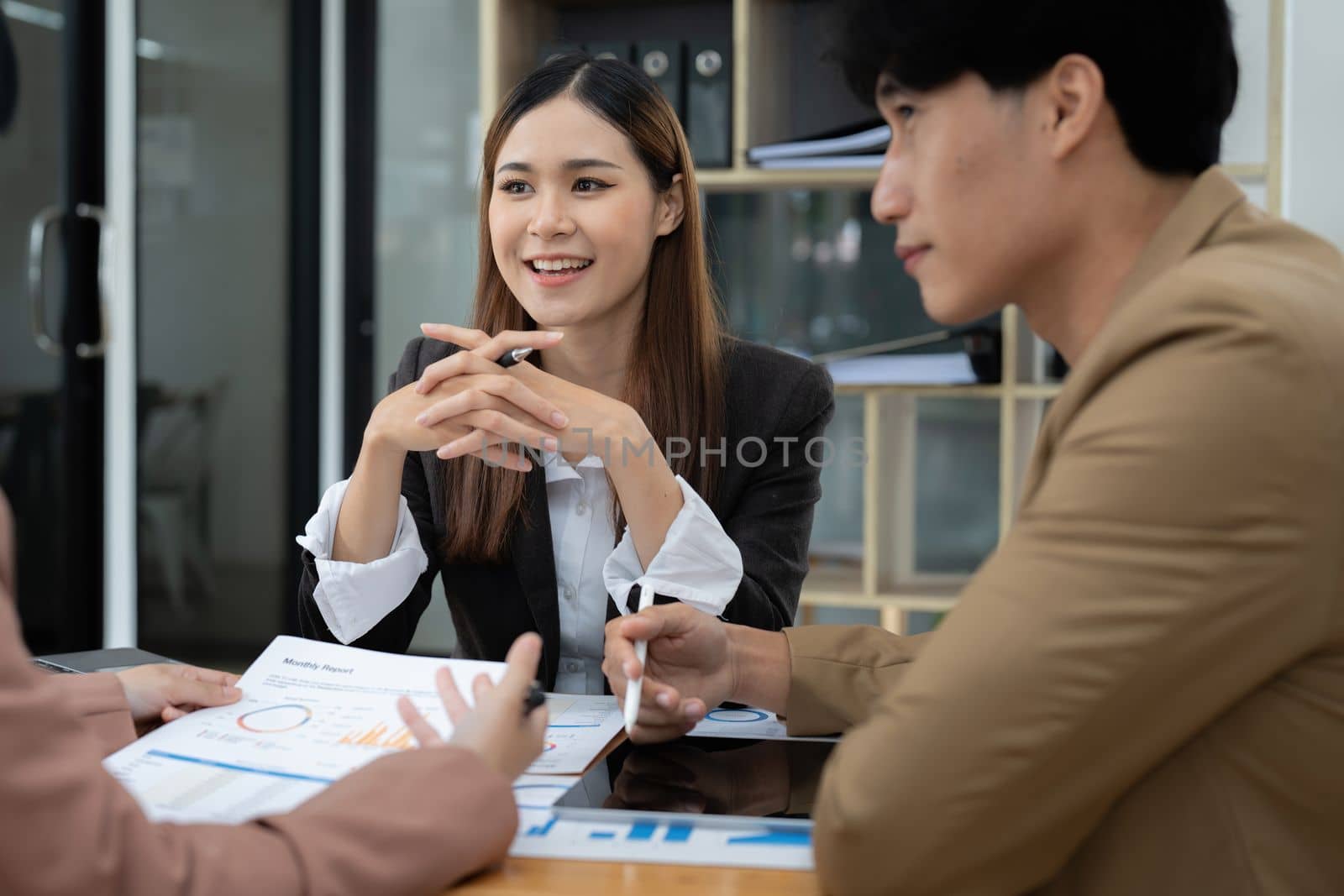 Fund managers team consultation and discuss about analysis Investment stock market by digital tablet.