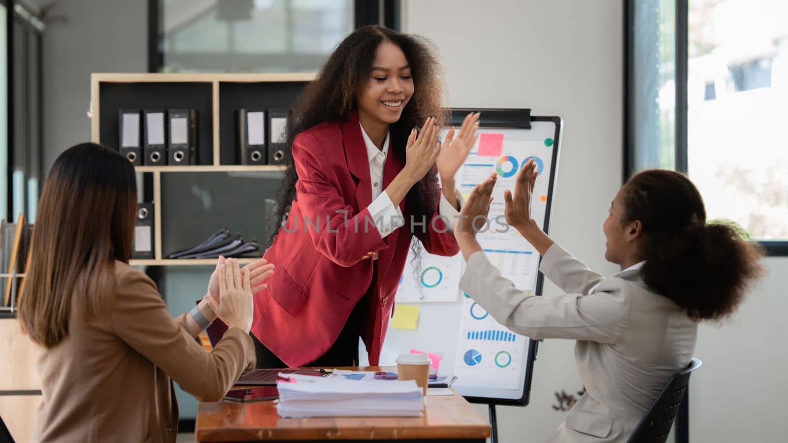 Smiling Businesswoman working with partner at office. finance concept.