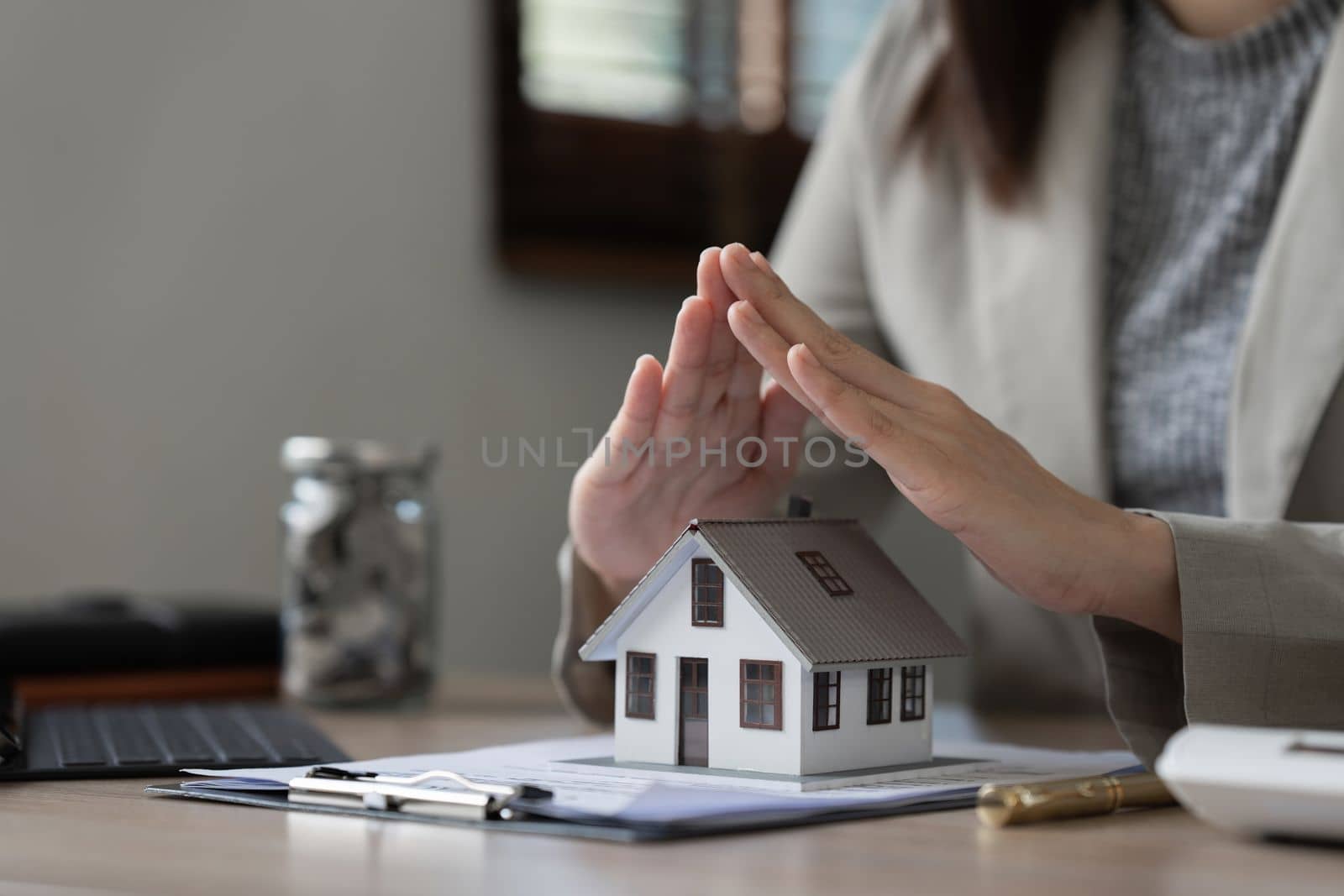 Real estate agent and customer discussing for contract to buy house, insurance or loan real estate background by itchaznong