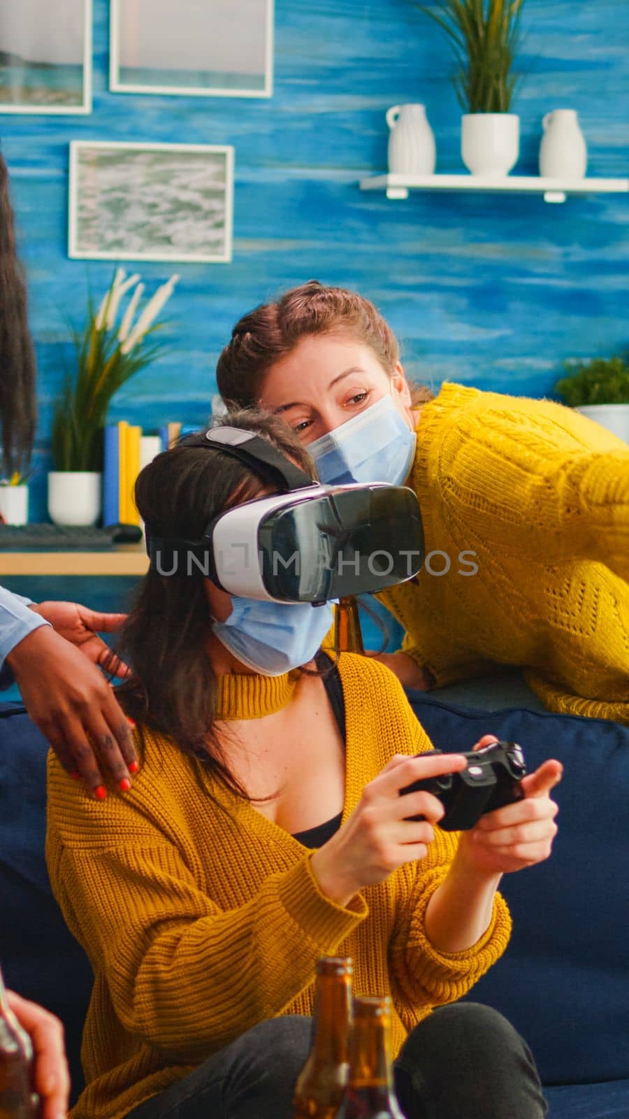 Woman playing video games wearing vr headset by DCStudio