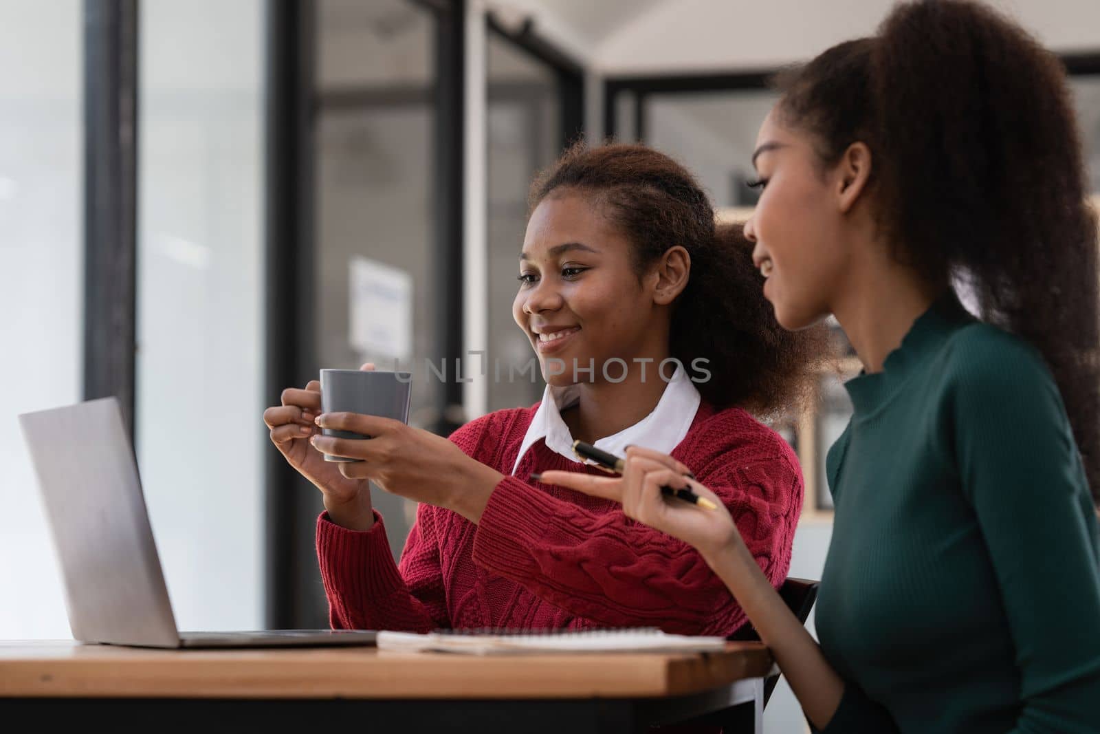Two Black Business women at casual meeting room discussing and brainstorm idea about marketing. Business consult concept.