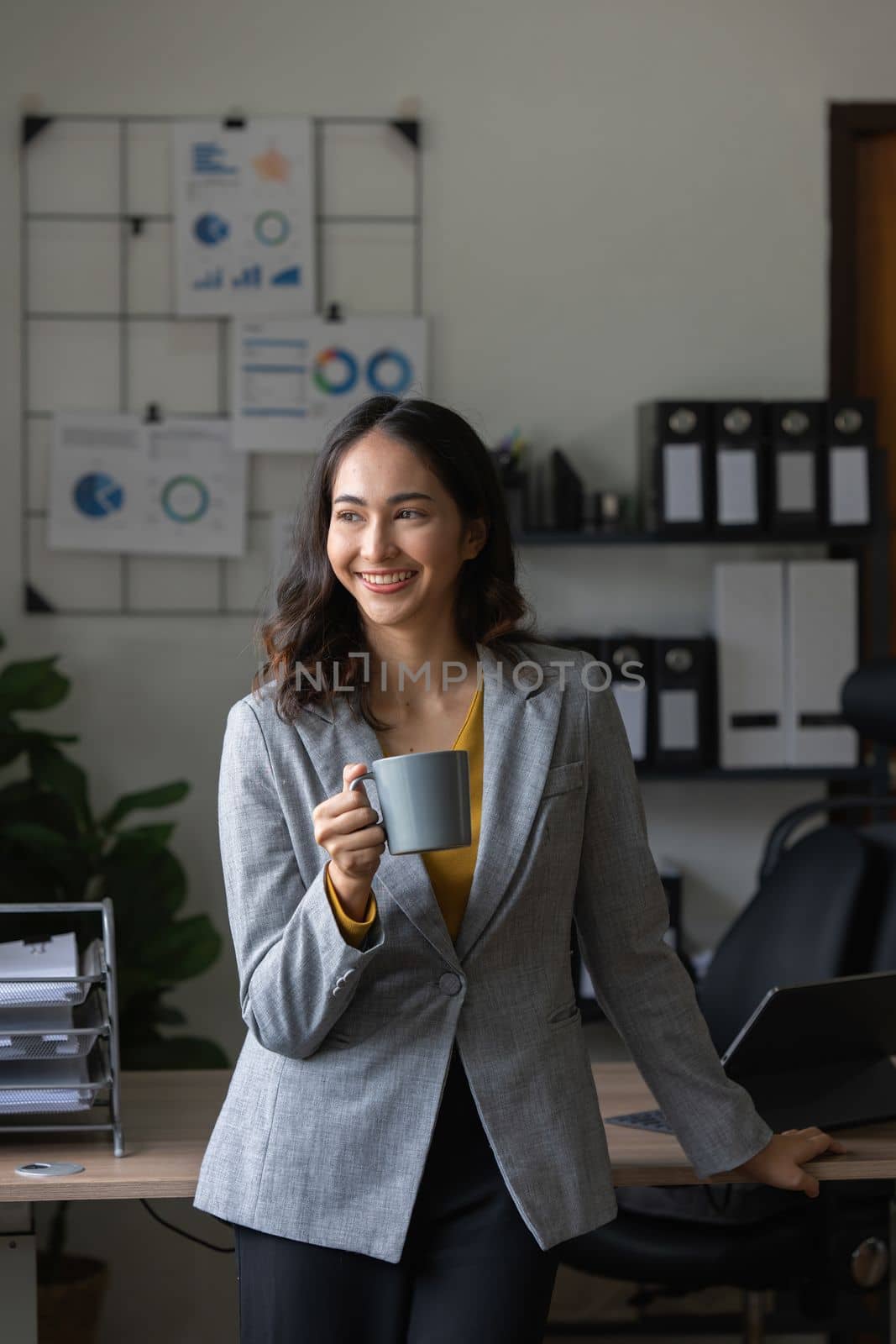 Beautiful asian businesswoman working in office. business finance concept.
