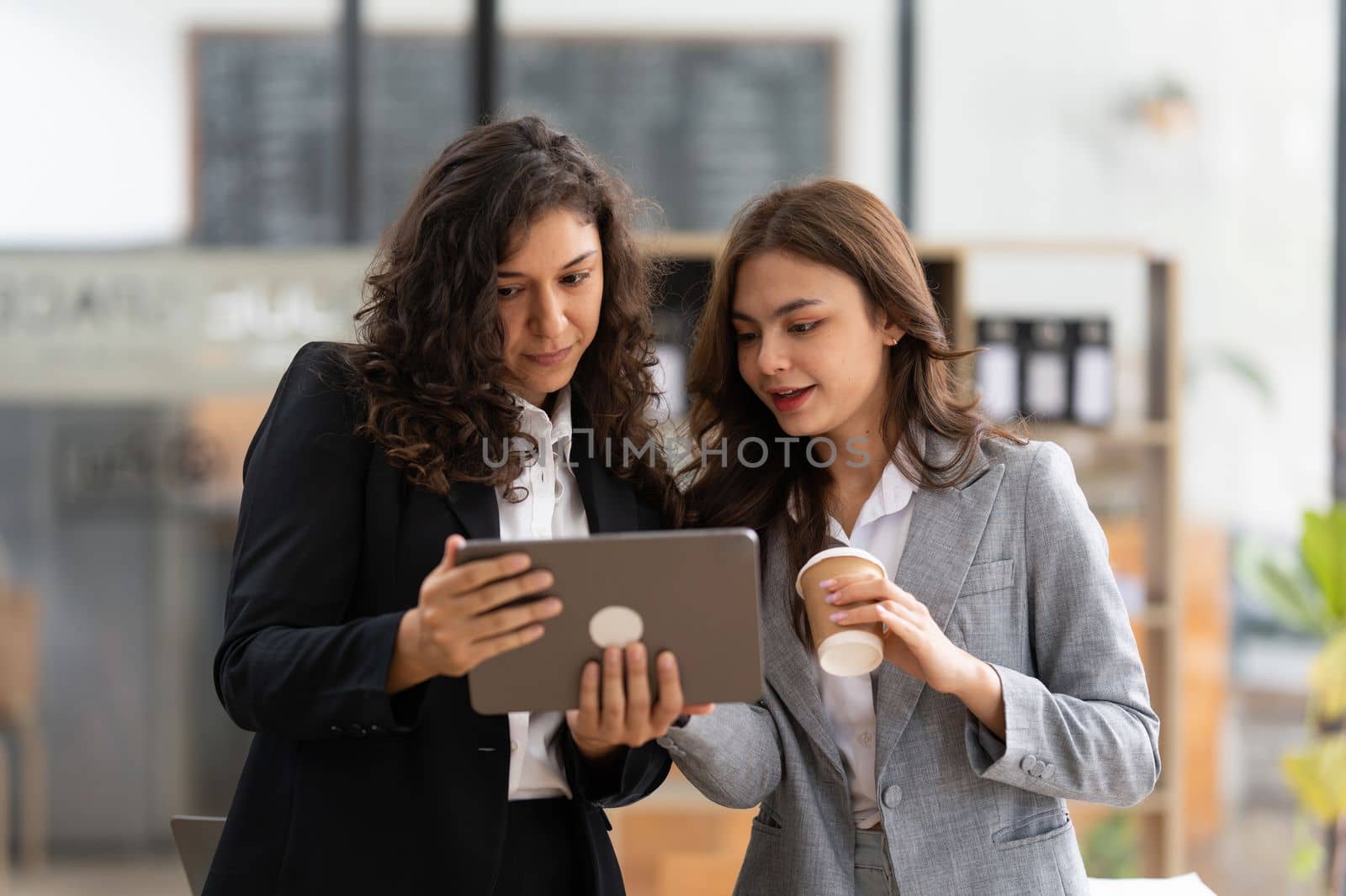 Fund managers team consultation and discuss about analysis Investment stock market by digital tablet.