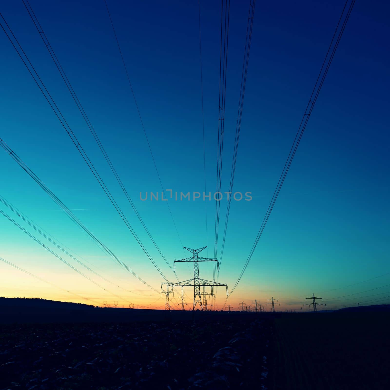 High voltage pylons. Rising energy prices - a concept for industry and energy. Increasing the price of electricity. Concept for industry and energy. The crisis in Europe caused by Russian aggression and the war in Ukraine. by Montypeter