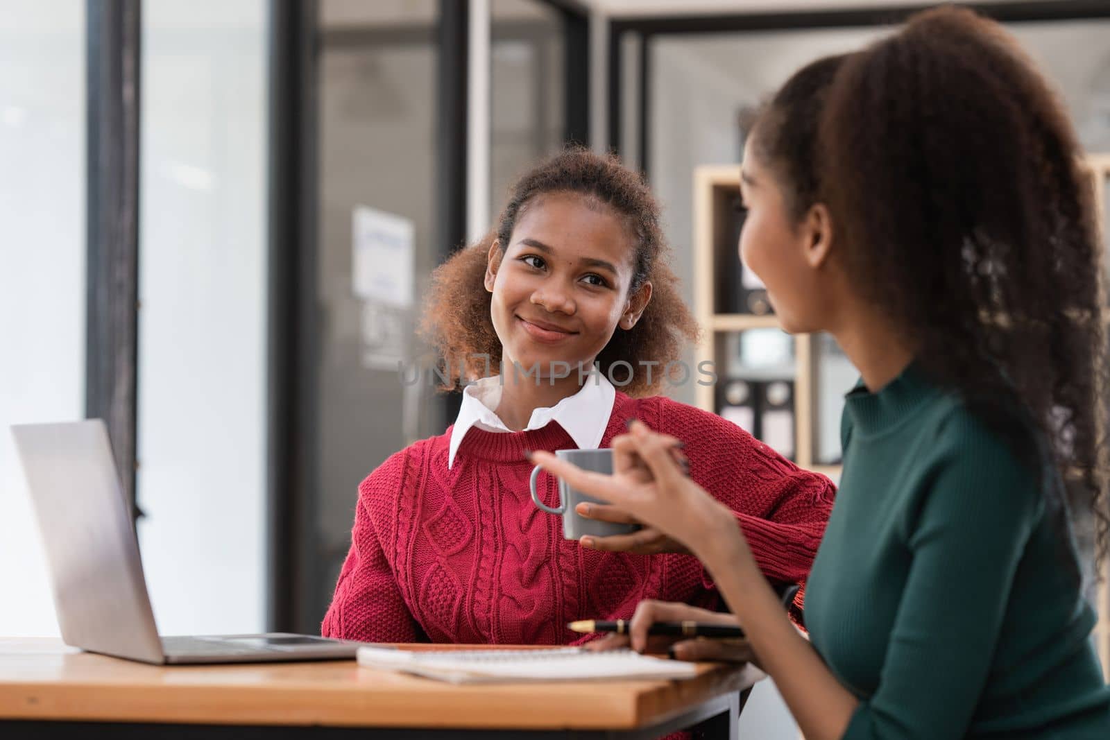 Two Black Business women at casual meeting room discussing and brainstorm idea about marketing. Business consult concept.