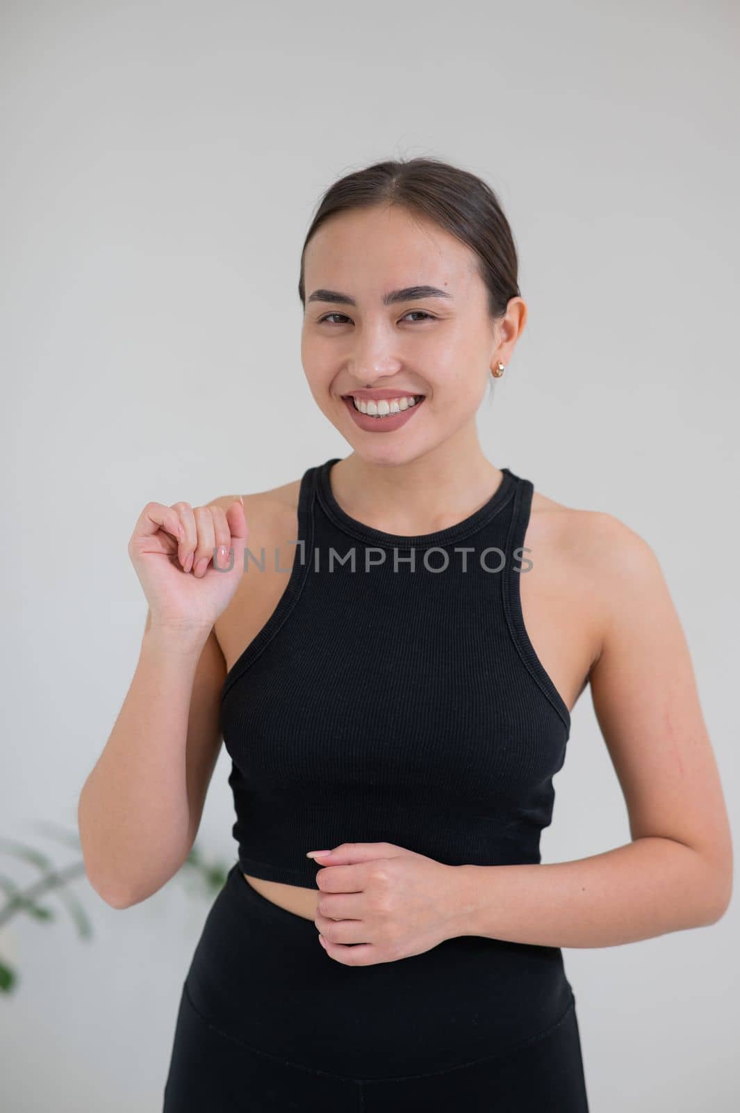 Portrait of a smiling Asian woman on a white background