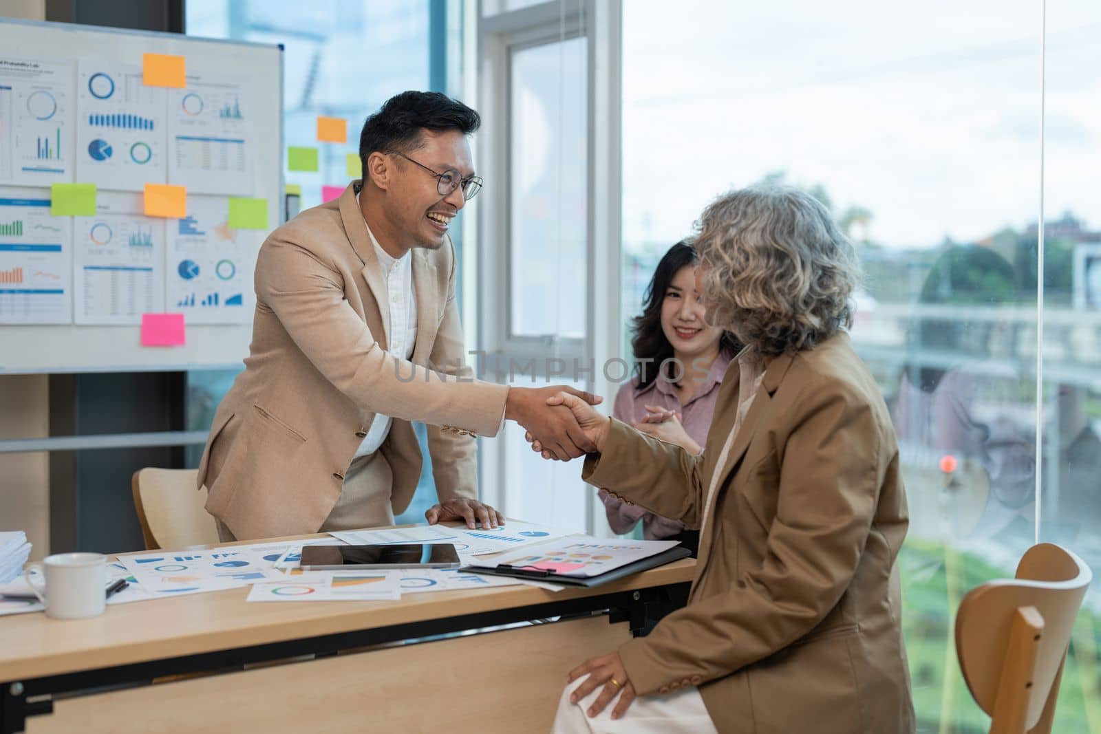 Image businessmans handshake. Successful business people handshaking after good deal.