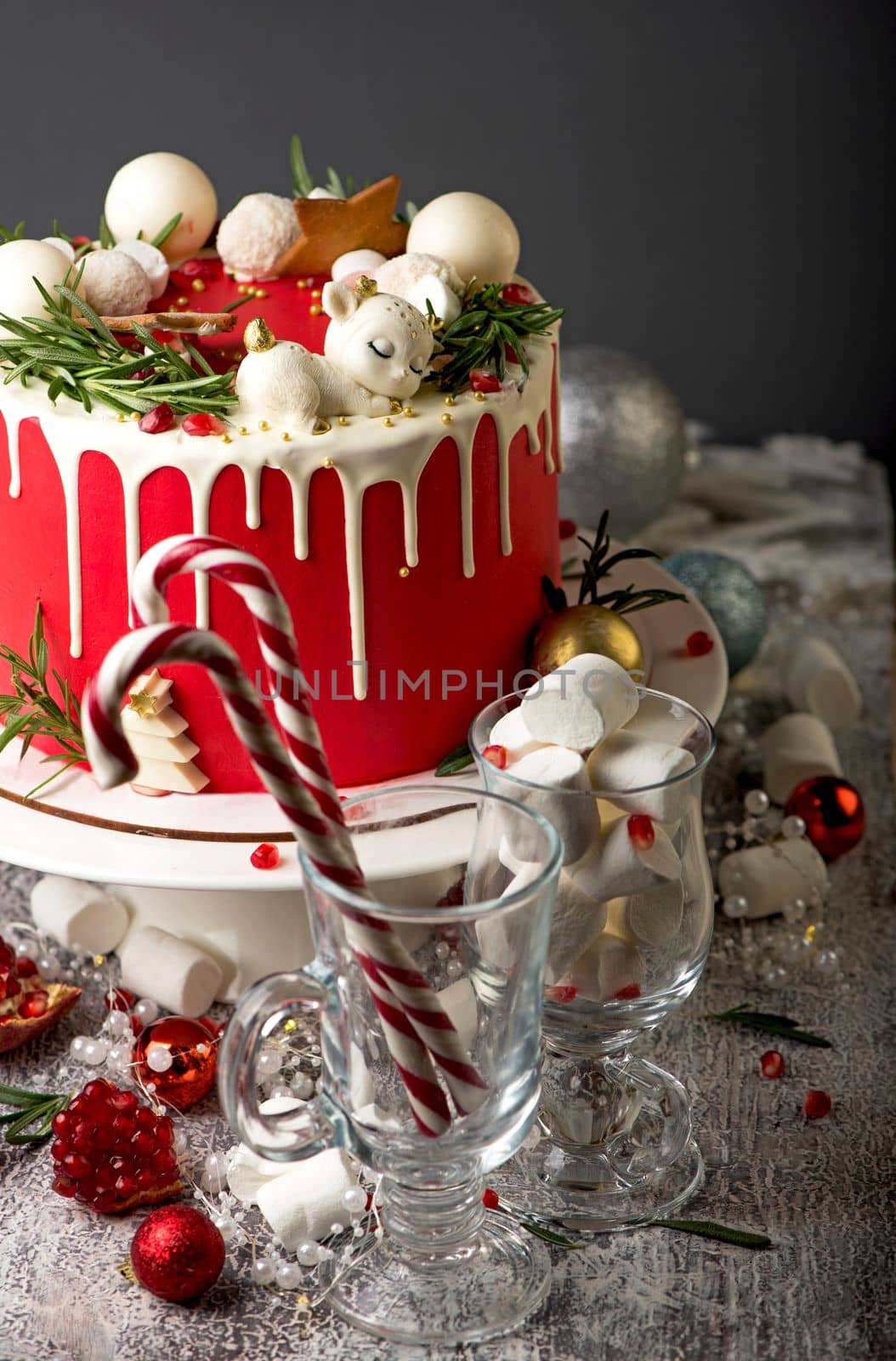 Festive Christmas cake on a rustic wooden stand and holiday decoration. New Year cards and sparklers by aprilphoto