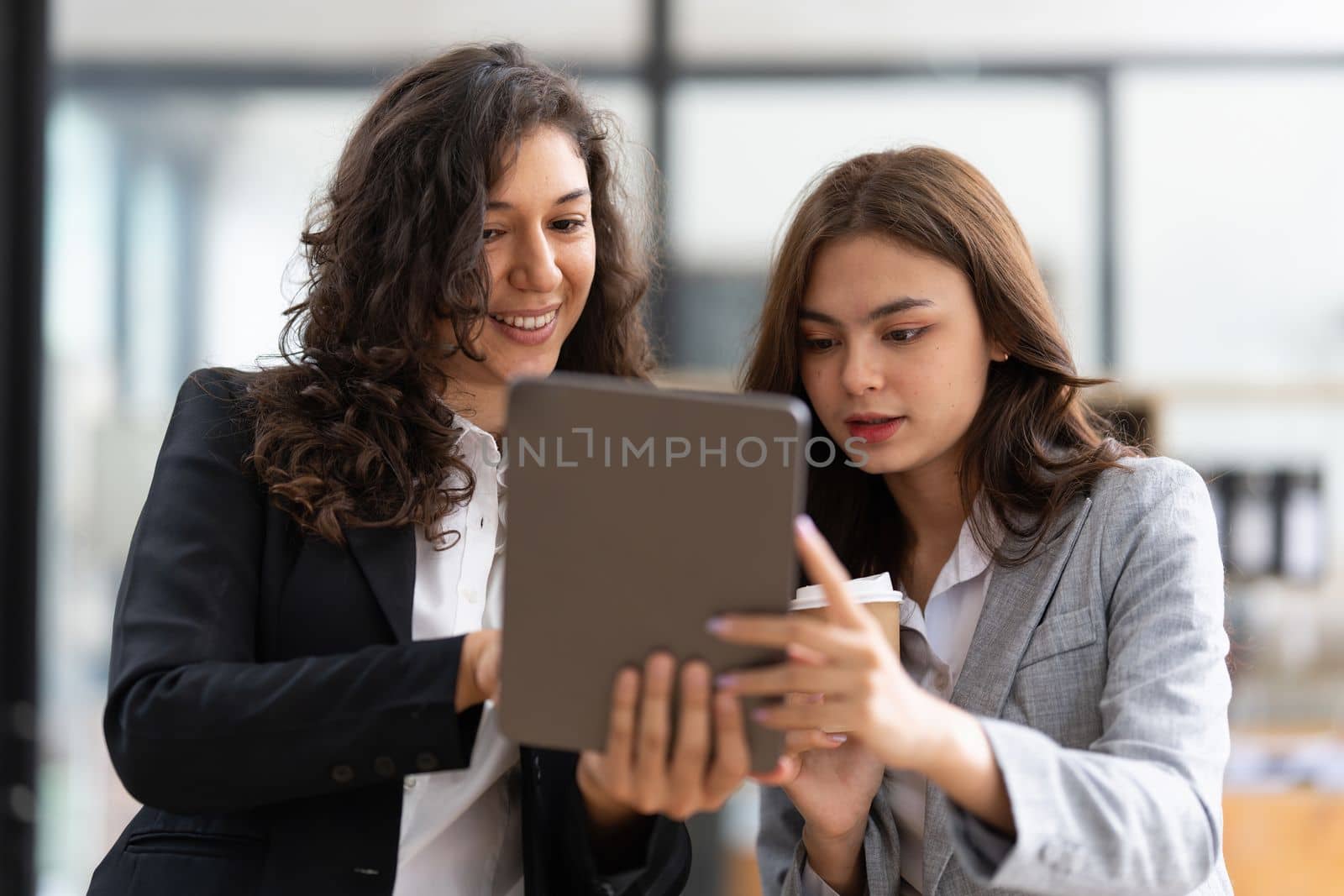 Fund managers team consultation and discuss about analysis Investment stock market by digital tablet.