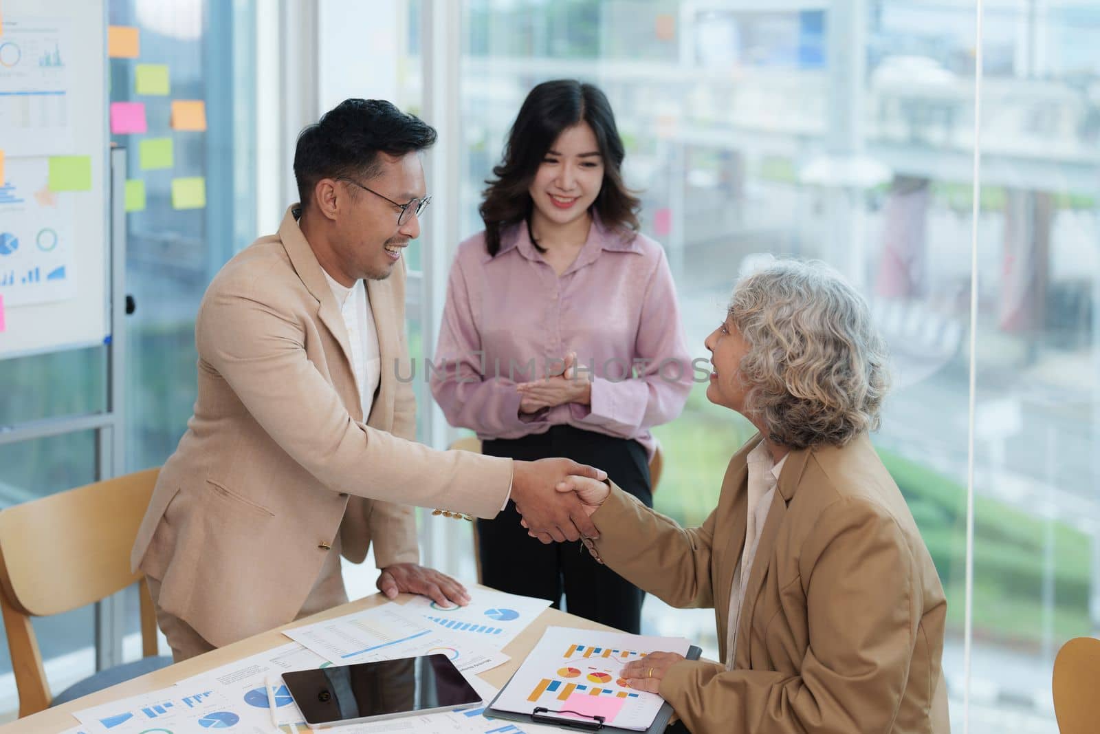 Image businessmans handshake. Successful business people handshaking after good deal.