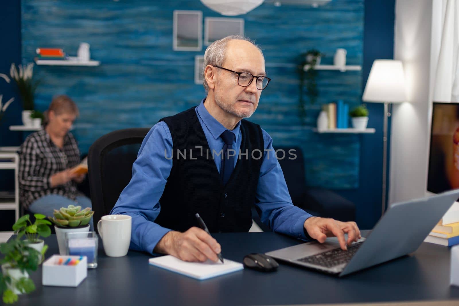 Portrait of mature man doing websurfing by DCStudio