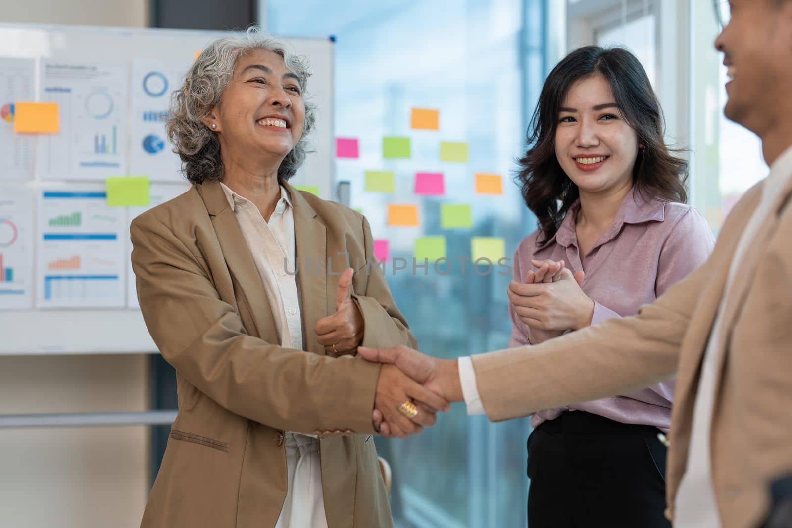 Business partnership meeting concept. Image businessmans handshake. Successful businessmen handshaking after good deal. Group support concept.