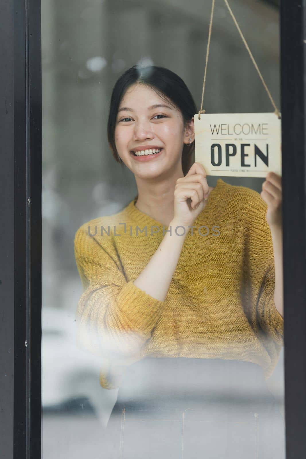 Portrait of Startup successful small business owner in coffee shop. SME entrepreneur seller business concept.