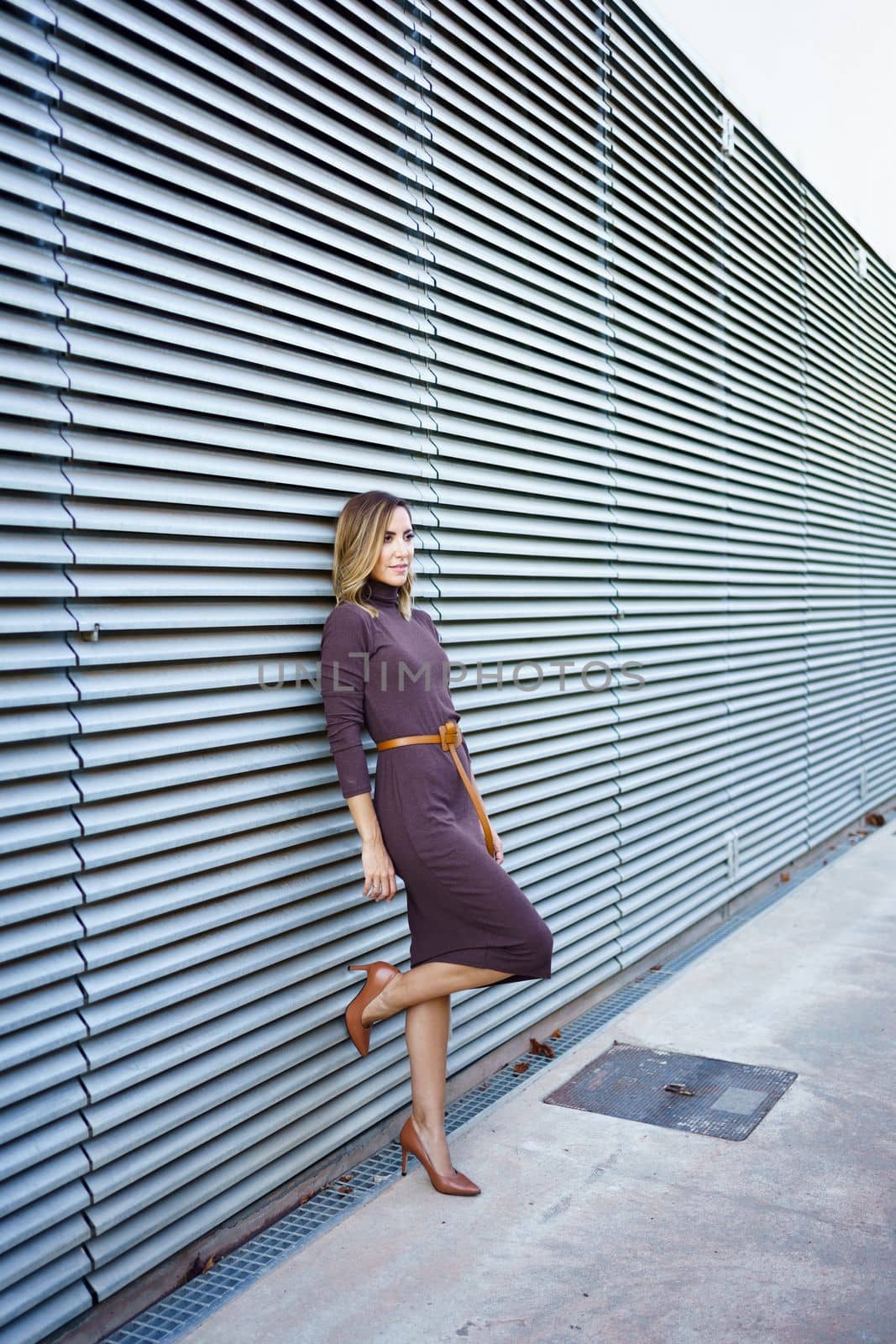 Businesswoman leaning on wall by javiindy