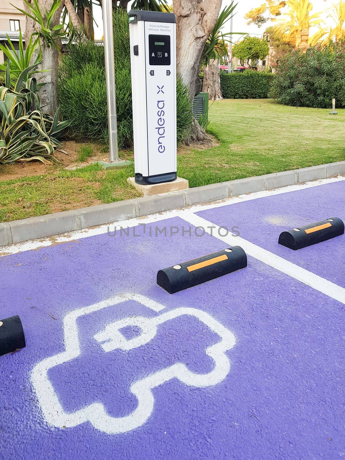 Jerez de la Frontera, Andalusia, Spain. 7 July 2021. Charging point for electric vehicles of the Endesa company located on the street. by javiindy