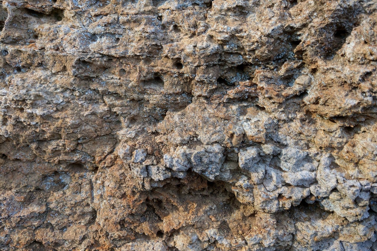 Close-up of the rocks. The background of the mountains. The texture of the stone