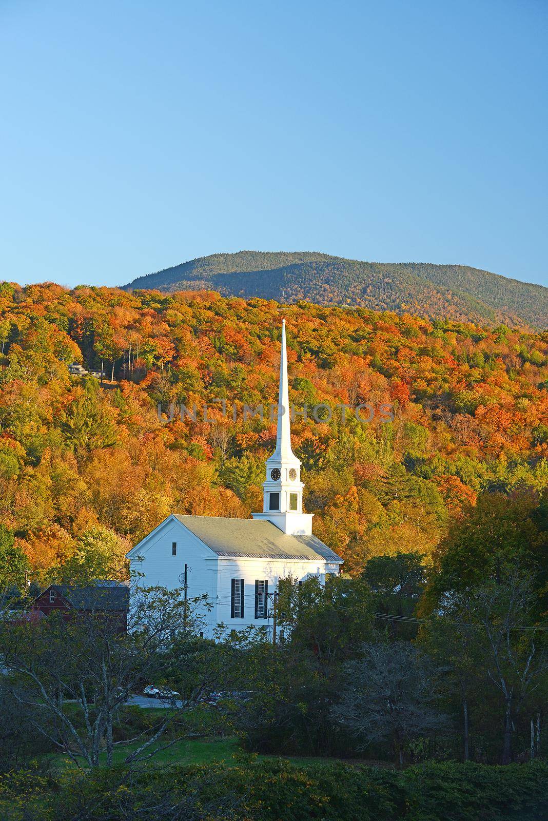 a church in autumn at stowe, vermont
