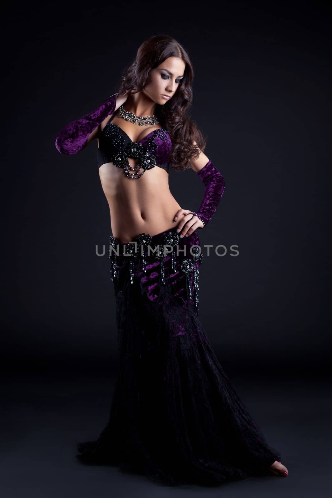 Full length portrait of pretty oriental dancer