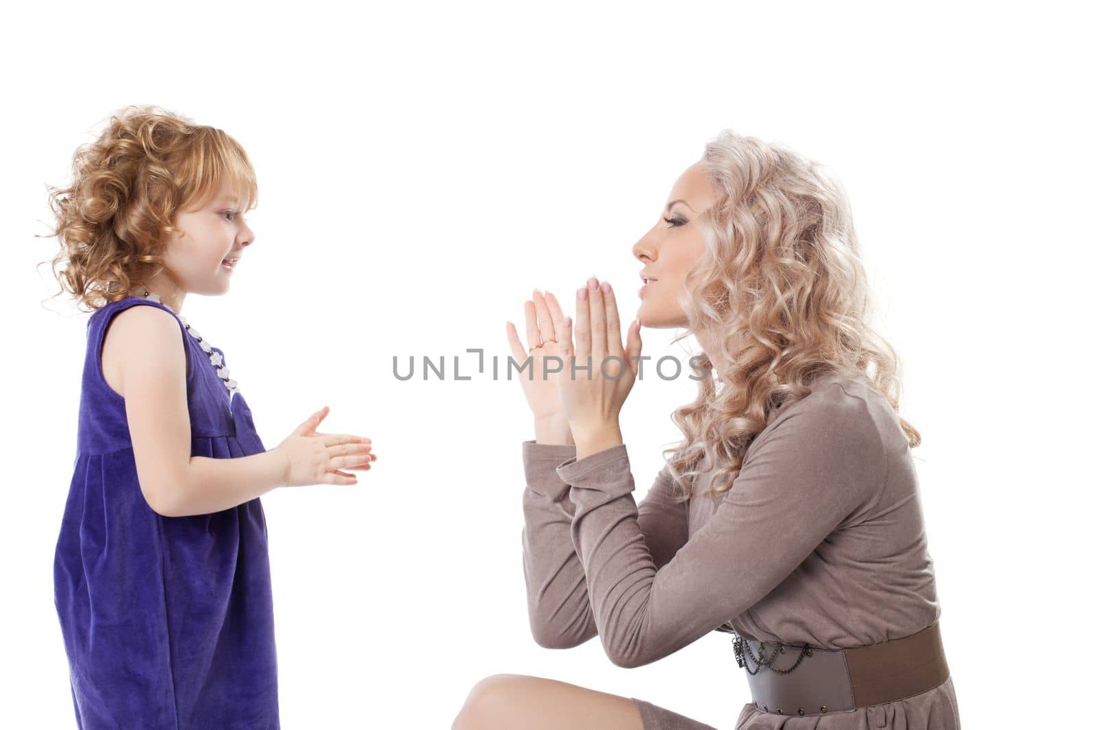 Mother and daughter play. Isolated on white