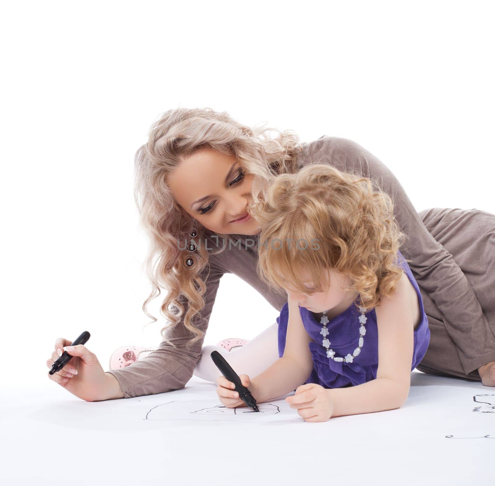 Mother and daughter draw. Isolated on white