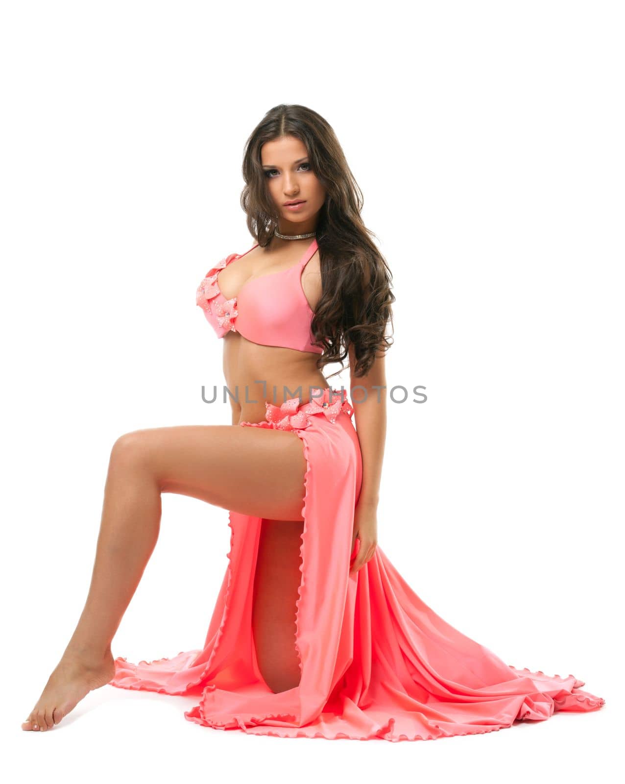 Portrait of beautiful oriental dancer in pink costume. Isolated on white