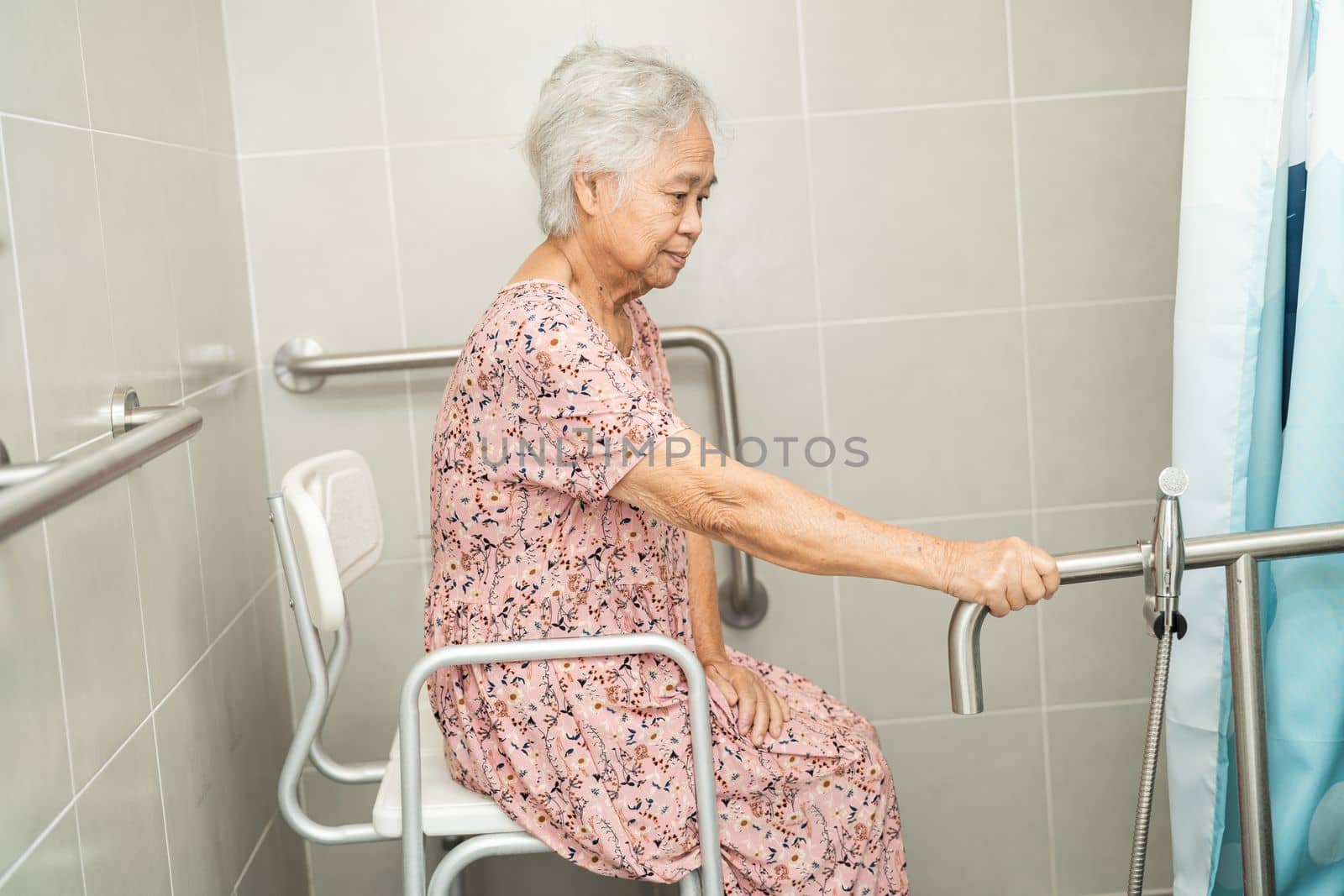 Asian senior or elderly old lady woman patient use toilet bathroom handle security in nursing hospital ward, healthy strong medical concept.