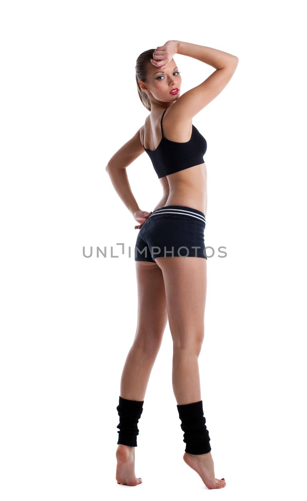 happy young woman posing in fitness costume by rivertime