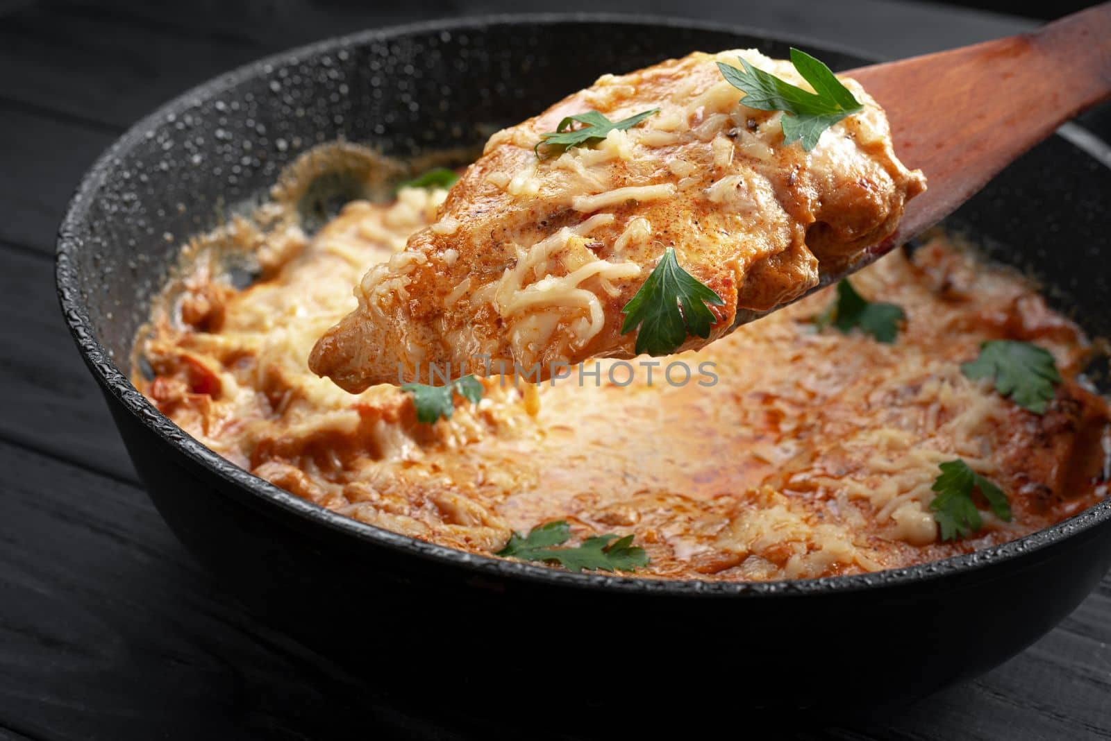 Chicken tikka masala. Black background. Place for text. Chicken in oil, a traditional Indian dish. Top view. Chicken tikka masala. Indian Cuisine by gulyaevstudio