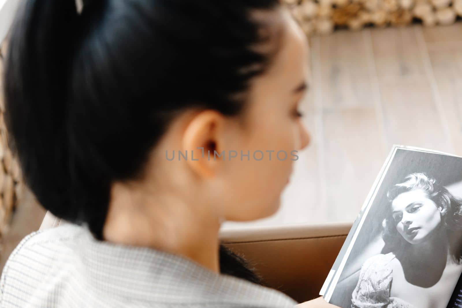 A young woman in a blazer reading a magazine. stress-free concept. mental health. Slow living. Enjoying the little things. Lykke concept by gulyaevstudio