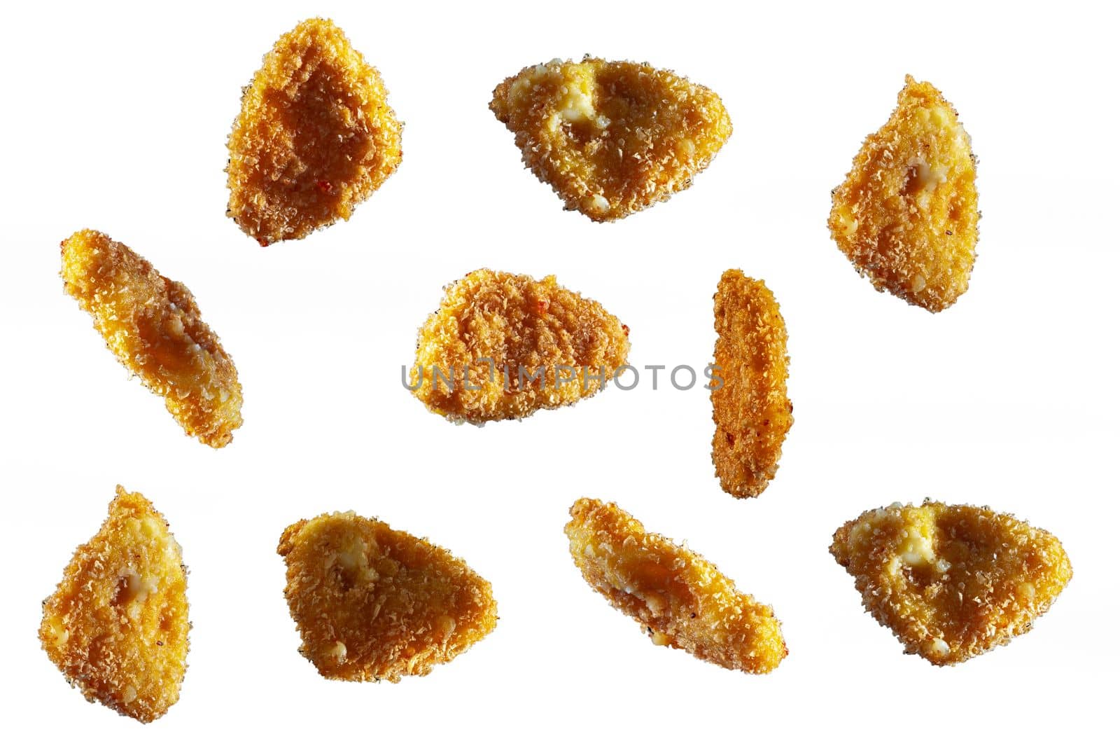 Flying food. chicken nuggets on a white background. Fried chicken in batter. Isolate.