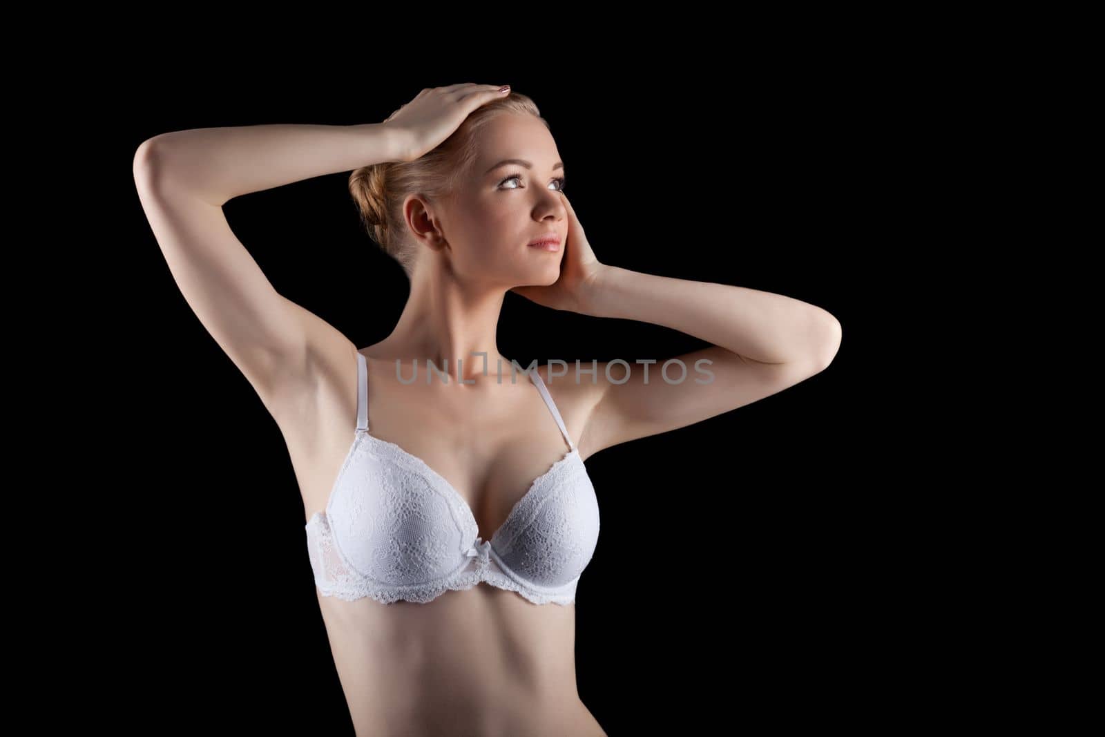 attractive young woman posing in beauty white lingerie in dark