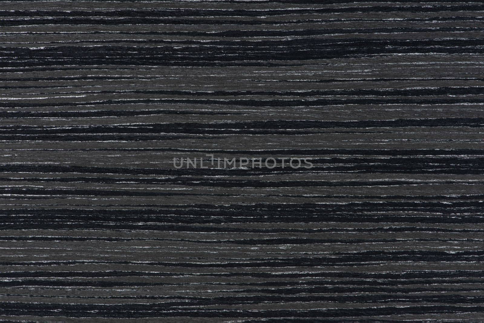 Texture of wood with stripes. Texture of natural African wood with zebra pattern. High resolution photo of a brown black board