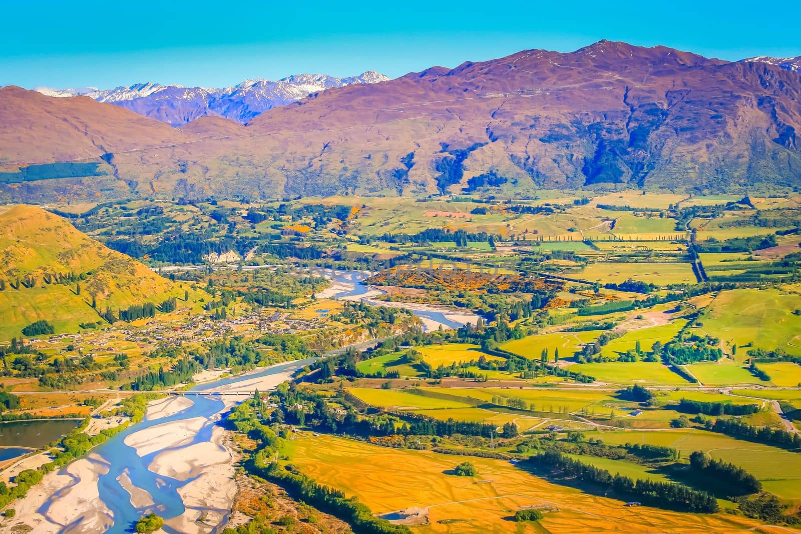 Above Queenstown countryside and river in south Island, Otago, New Zealand at sunset