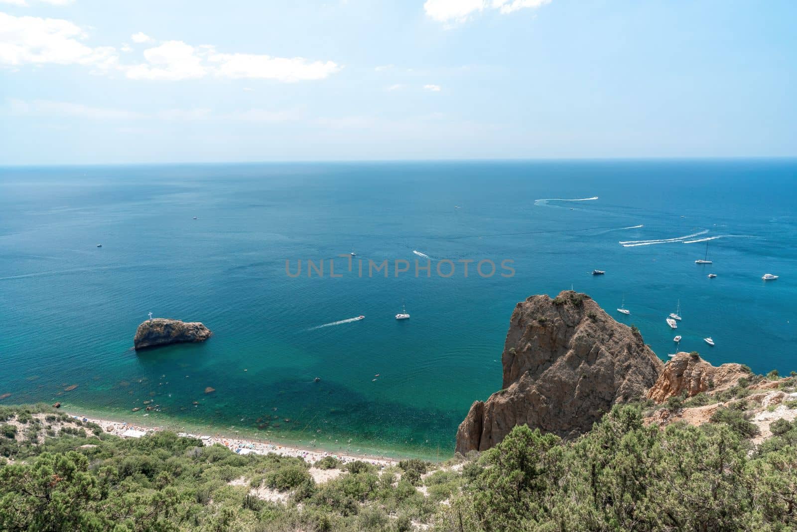 Sea lagoon. Panoramic view on calm azure sea and volcanic rocky by panophotograph