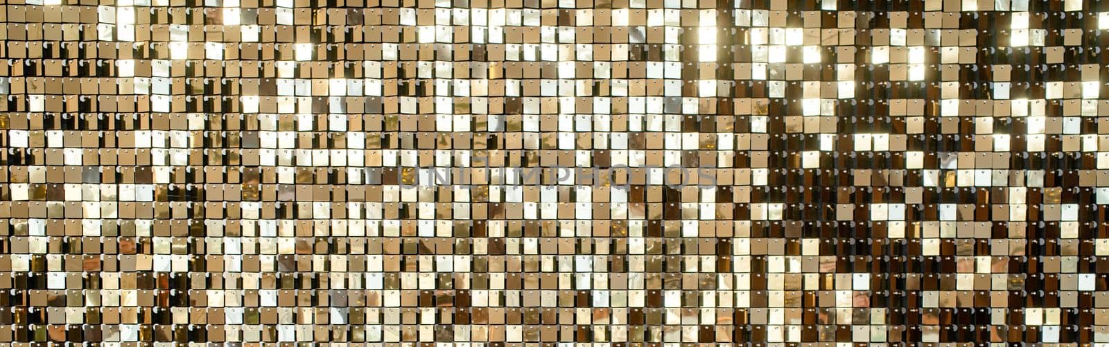Abstract festive golden background. Golden metal shiny pieces making festive abstract texture