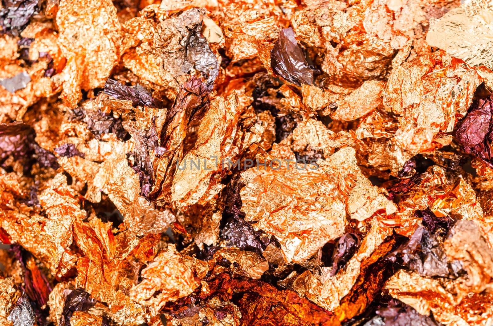 Background image of crumpled pieces of gold foil in close-up.Macrophotography.