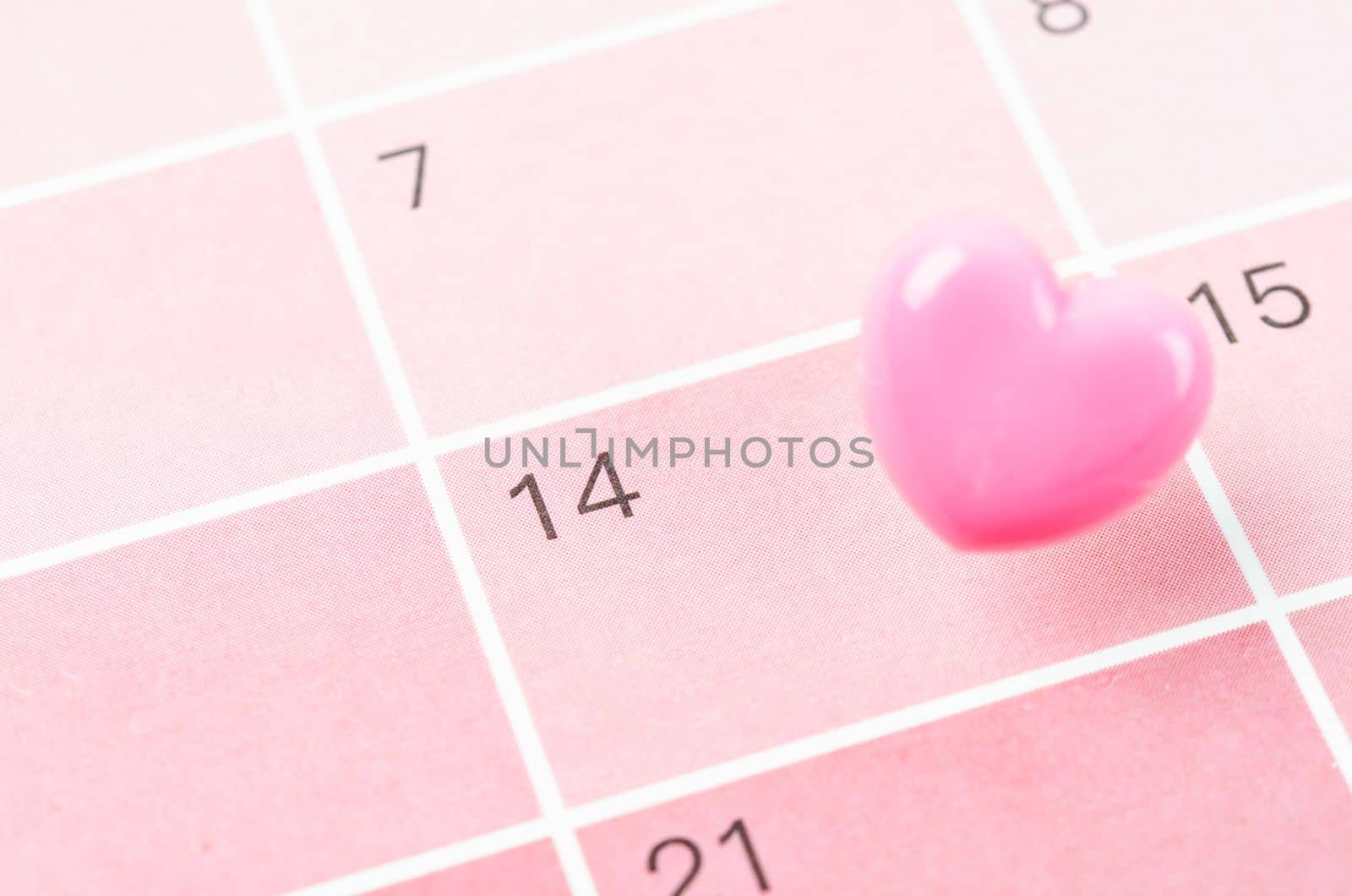 Blank 14 February Valentine's Day Calendar with pink heart push pin.