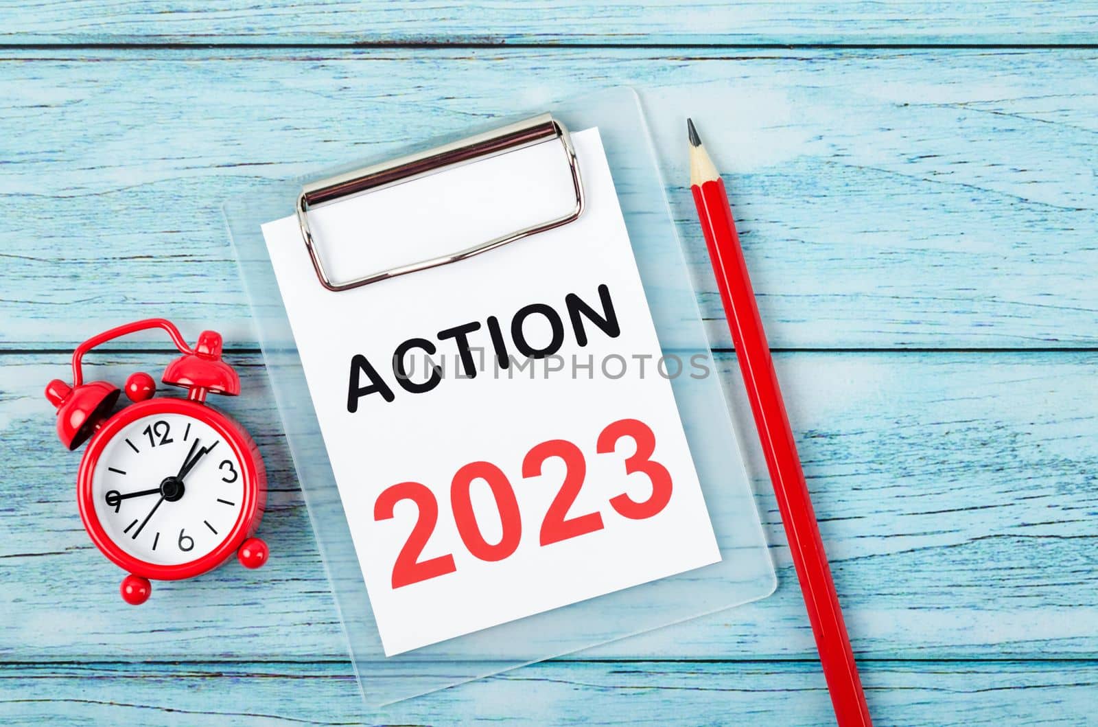 2023 Action; Goal and Target Setting List for 2023 year with alarm clock. Change and determination concept.